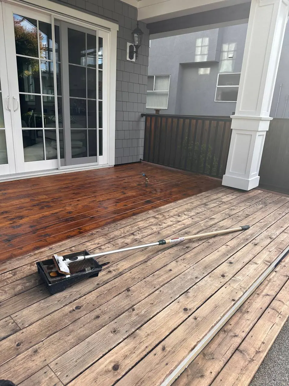 Deck staining process — applying stain to Tsawwassen deck boards