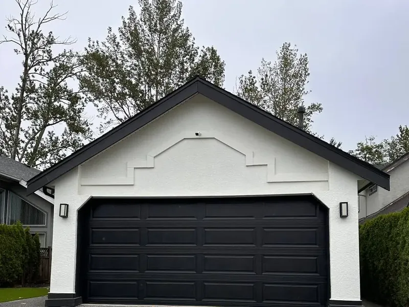 The same garage door after a black spray repaint